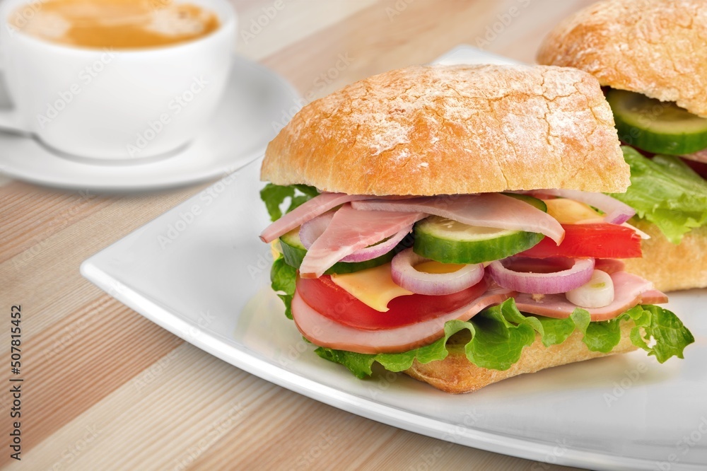 Tasty sandwich with cheese, mayonnaise and cherry tomatoes. Mediterranean appetizer. Breakfast concept. Tasty sandwich with cheese, mayonnaise and cherry tomatoes. Mediterranean appetizer. Breakfast concept.