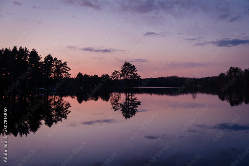 Mirror sunset on a lake in Sweden