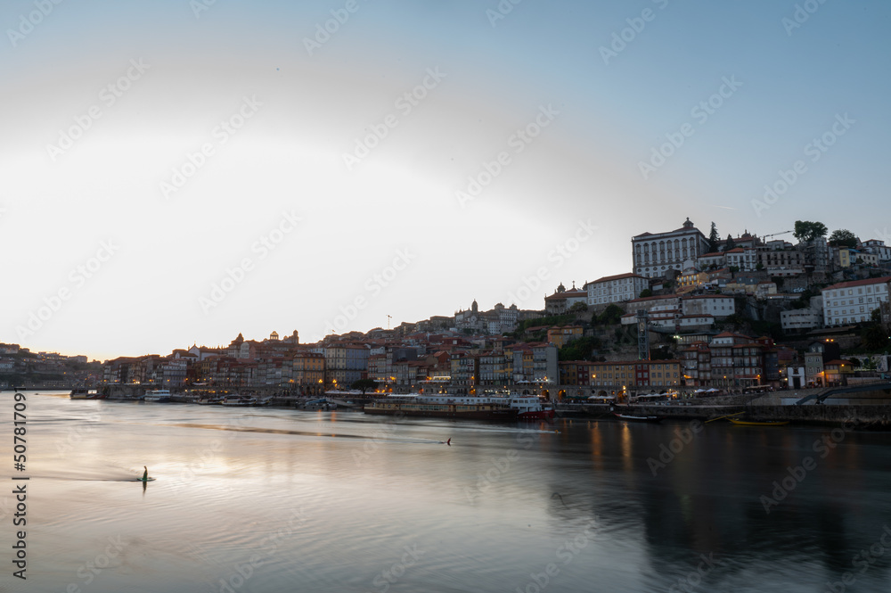 Cityscape of Porto over the Douro Luis II river in Porto, Portugal in Summer 2022.