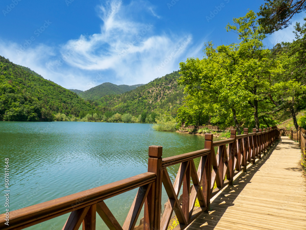 Wooden walkway by Lake Boraboy on a sunny spring day.
