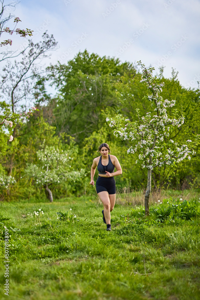portrait of a strong woman training in nature portrait of a strong woman training in nature