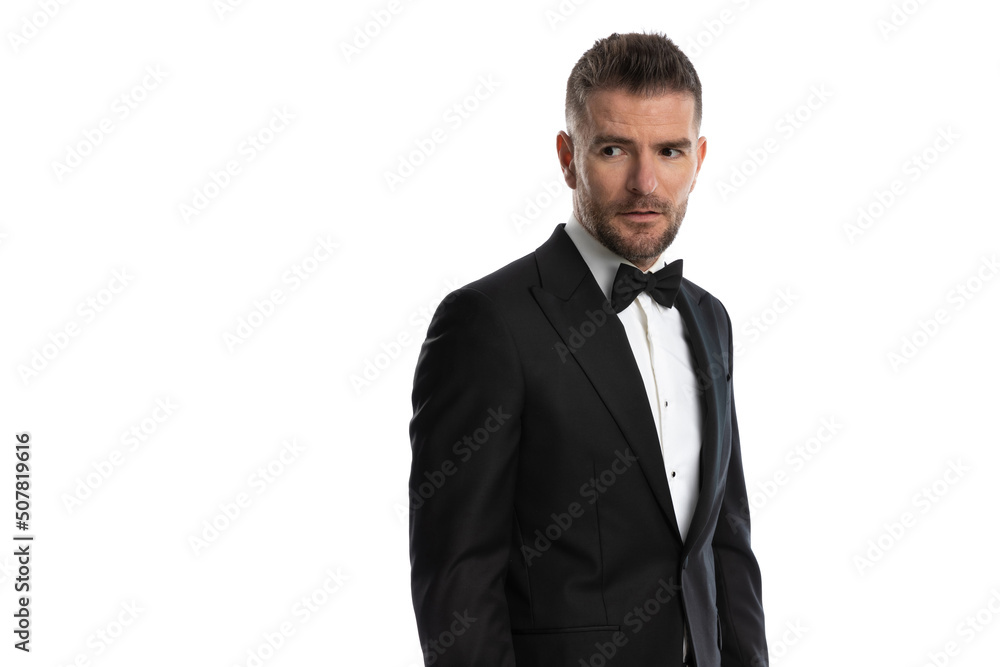 businessman looking away and wearing a cool tuxedo businessman looking away and wearing a cool tuxedo