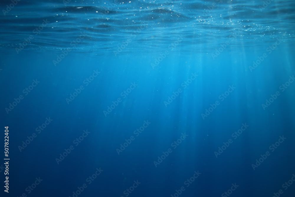 ocean underwater rays of light background, under blue water sunlight - obrazy, fototapety, plakaty 