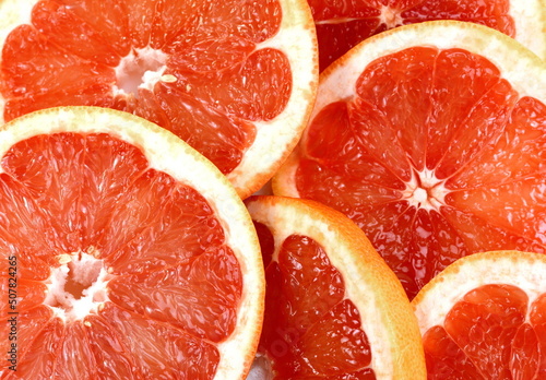 Top view of grapefruit slice, as background. Macro of red grapefruit. fruit citrus grapefruit texture background