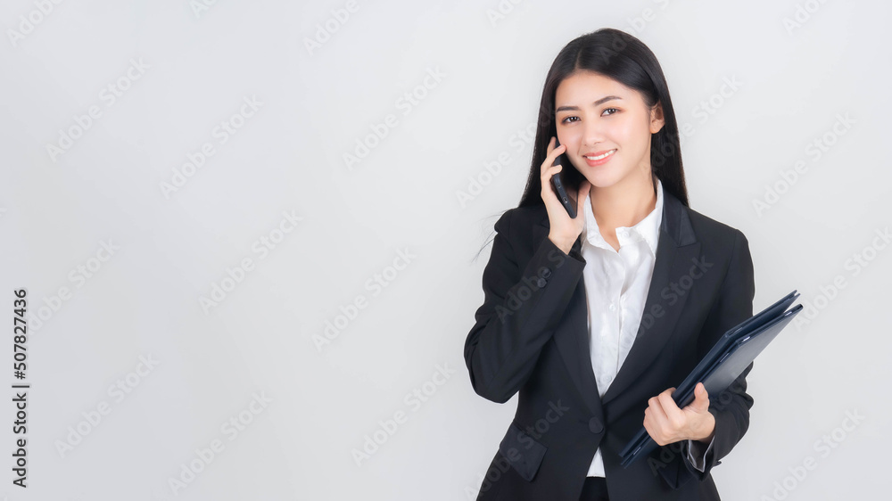 business woman , beautiful Asian girl whit suit using smart phone shopping online and online banking isolated on white background with copy space , business concept business woman , beautiful Asian girl whit suit using smart phone shopping online and online banking isolated on white background with copy space , business concept