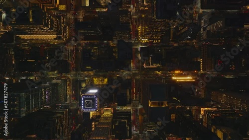 Aerial birds eye overhead top down view of town development. Night city from height. Traffic in streets. Manhattan, New York City, USA