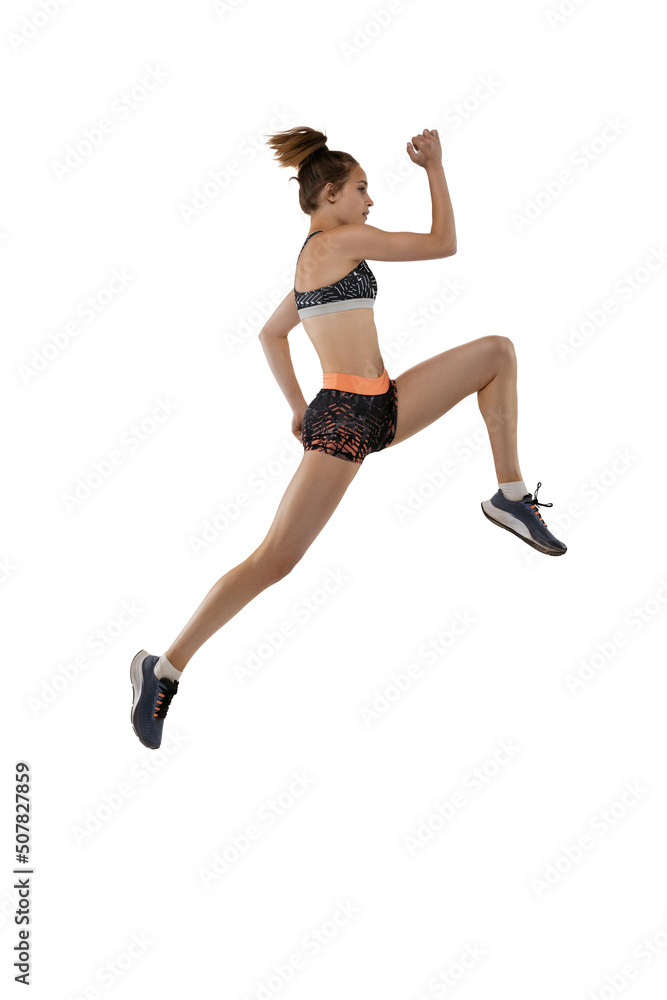 Long jump technique. Studio shot of professional female athlete in sports uniform jumping isolated on white background. Concept of sport, action, motion, speed.