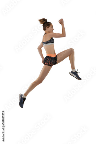 Fototapeta Naklejka Na Ścianę i Meble -  Long jump technique. Studio shot of professional female athlete in sports uniform jumping isolated on white background. Concept of sport, action, motion, speed.