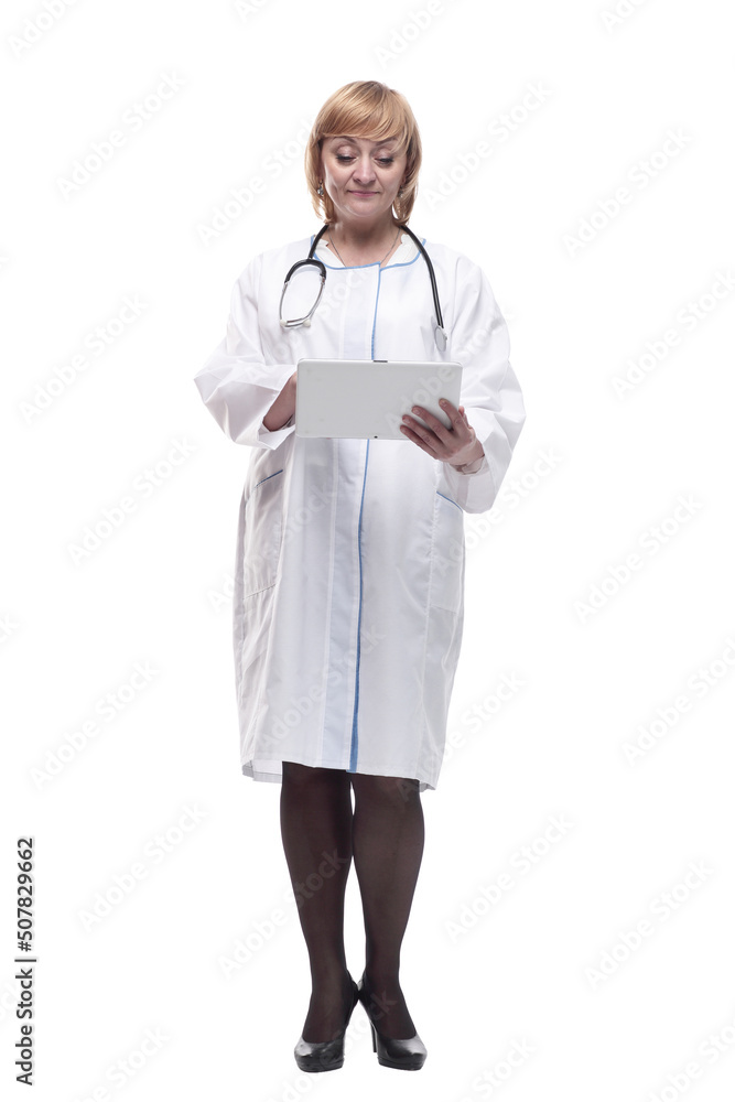 full-length. Mature woman doctor with a digital tablet . full-length. Mature woman doctor with a digital tablet .