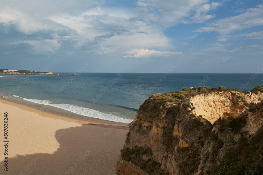 Beautiful empty beach Praia da Rocha in spring. Algarve region, Portugal Beautiful empty beach Praia da Rocha in spring. Algarve region, Portugal