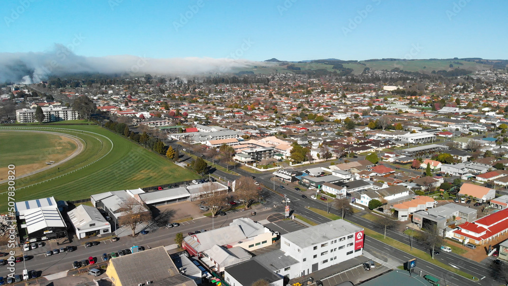 Panoramic aerial view of Rotorua landscape and geysers smoke, New Zealand from drone