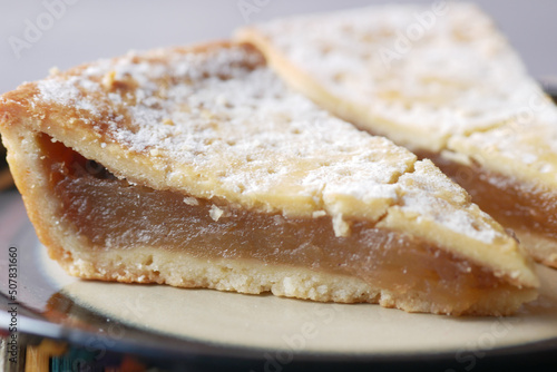 close up of slice of apple pie cake on a plate 
