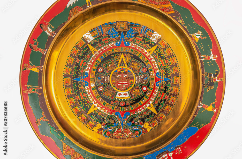 A replica of an Aztec calendar, on brass plate, from an original in Mexico.