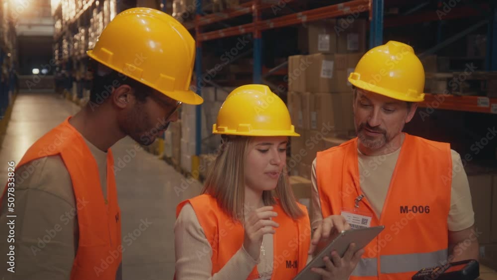 Female worker showing the colleagues where are the packages Female worker showing the colleagues where are the packages
