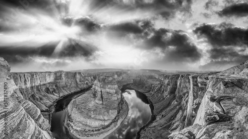 Horseshoe Bend panoramic aerial view, Arizona. Rocks and Colorado River at sunset in black and white.