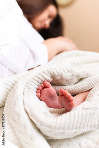 Newborn in his mother's arms, Ukrainian family