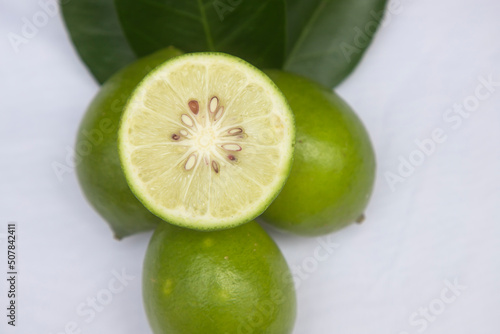 
Fresh green lemon slice pieces with leaf. testy lemon fruits. Refreshing summer drink ingredient
