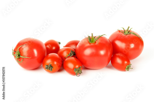 Large and small red tomatoes on a white background.