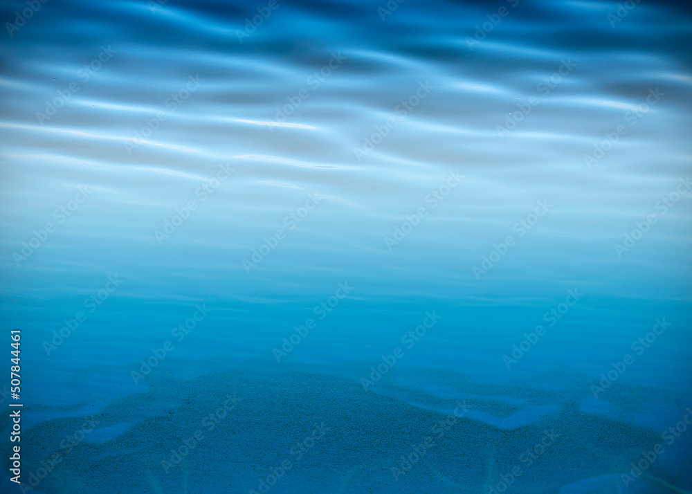 Underwater background, water surface, sandy bottom with space for text