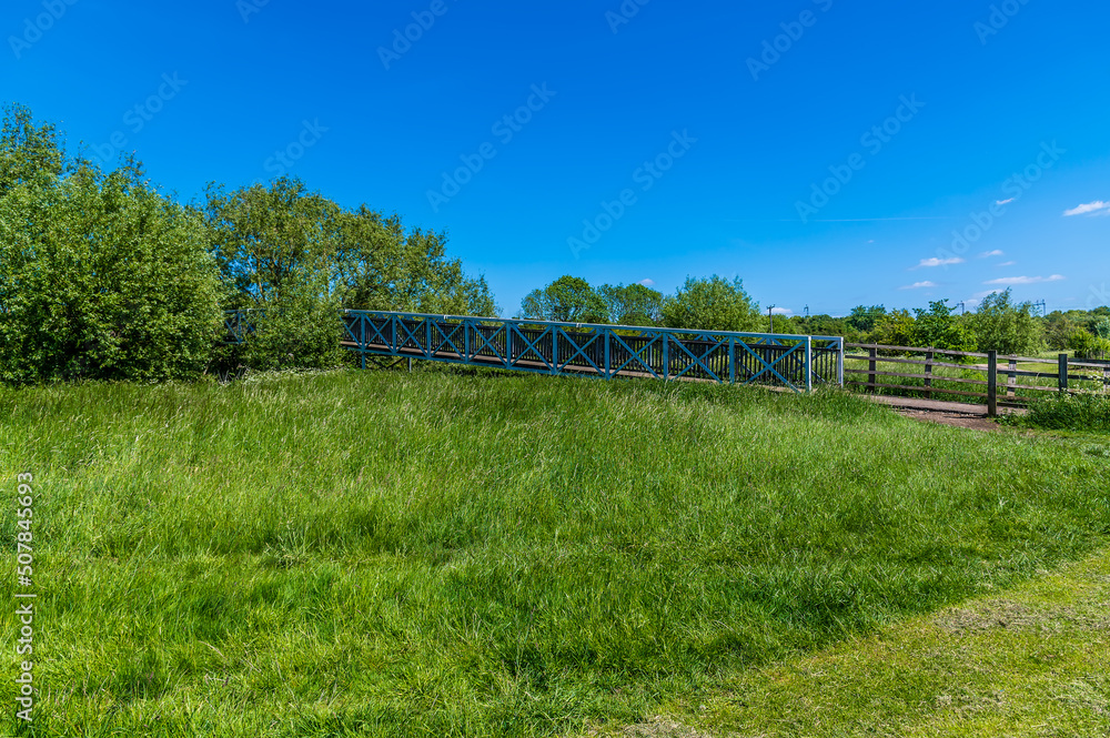 A view of a bridge over the river Great Ouse in the Ouse Valley Park at Wolverton, UK in summertime