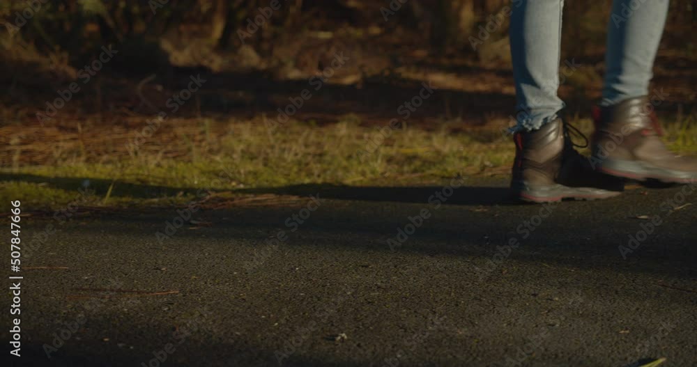 Close Up of Woman's Legs Walking on Paved Street on Golden Hour Close Up of Woman's Legs Walking on Paved Street on Golden Hour