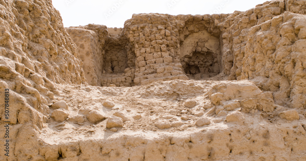 Ancient holes in mud brick wall ruins - cerro de Oro Lima, Peru