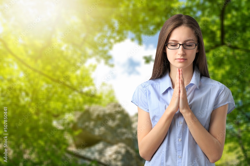The person prays at sunset. The believer prays. Prayer to God for peace in Ukraine. Prayer process. The person prays at sunset. The believer prays. Prayer to God for peace in Ukraine. Prayer process.