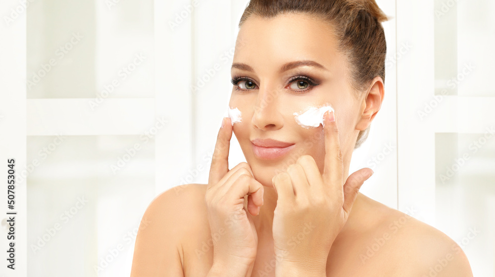 Concept of rejuvenation.Volume lifting.Applying the cream Concept of rejuvenation.Volume lifting.Applying the cream