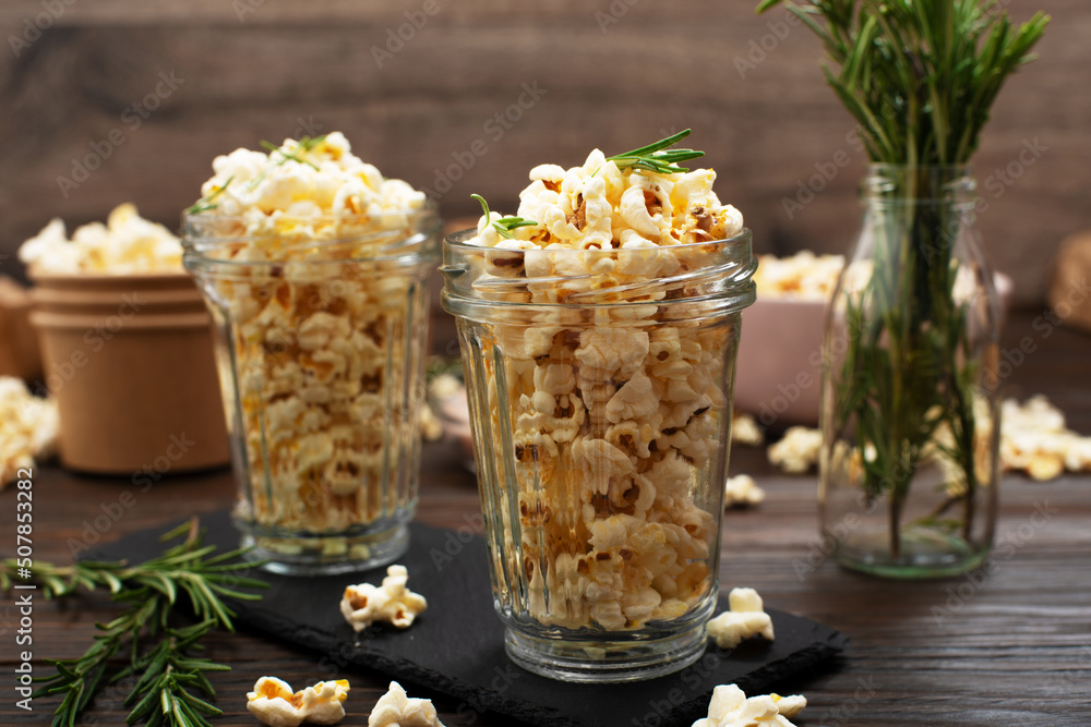 Glasses with popcorn on slate tray on kitchen table