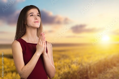 Canvas Print The person prays at sunset
