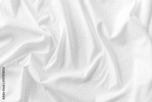 White fabric. luxurious white fabric texture background. Creases of satin, silk, and cotton.