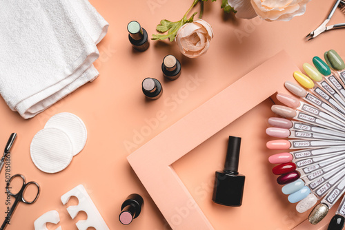 Set of manicure tools and accessories for hardware manicure, nail polish and design on a pink background. Flat lay, top view with Copy space. photo