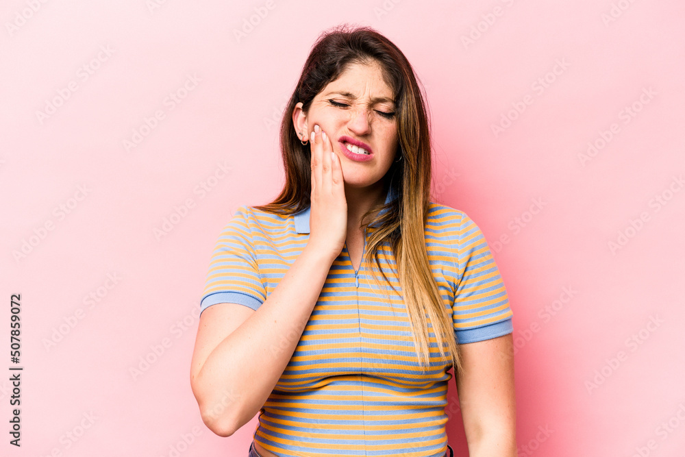 Young caucasian woman isolated on pink background having a strong teeth pain, molar ache. Young caucasian woman isolated on pink background having a strong teeth pain, molar ache.