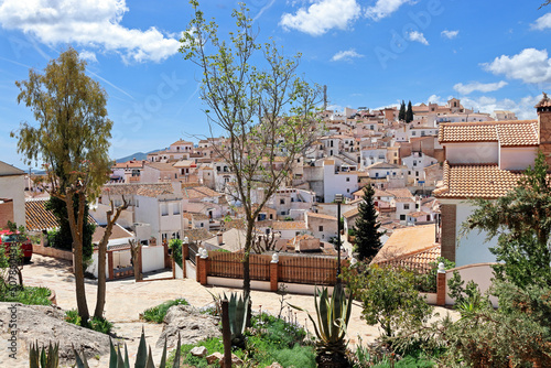 The Andalusian white village of Comares, on top of a hill in the mountains of the province of Malaga photo