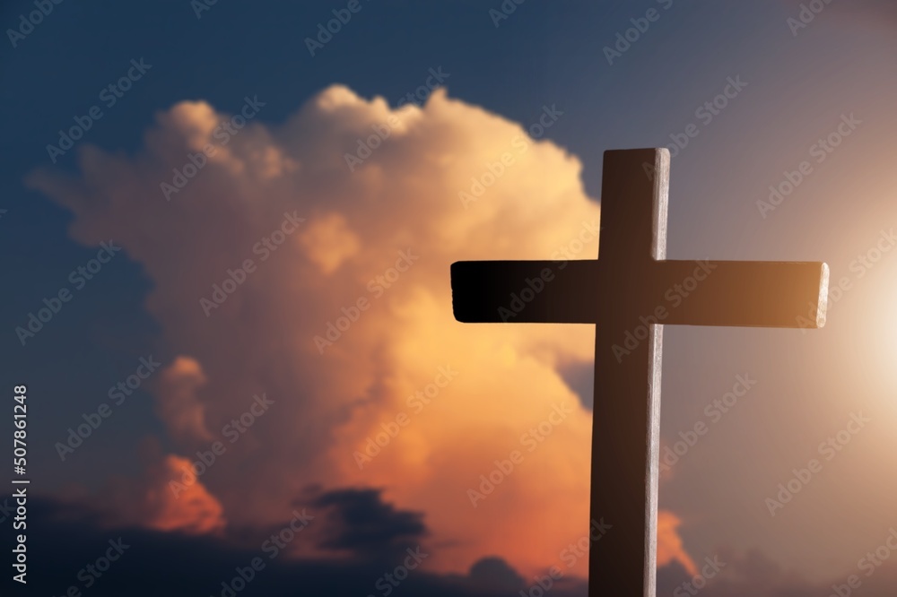 Classic wooden cross on sky background