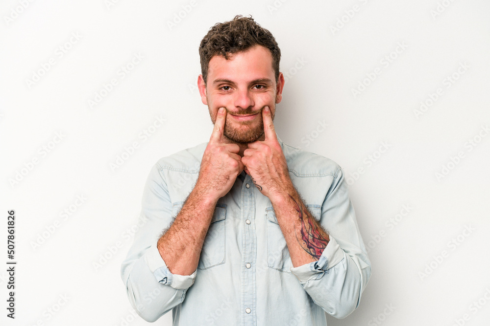 Young caucasian man isolated on white background doubting between two options. Young caucasian man isolated on white background doubting between two options.
