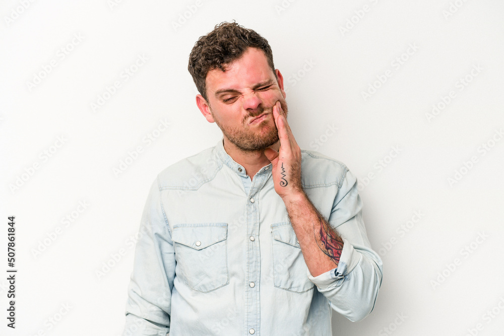 Young caucasian man isolated on white background having a strong teeth pain, molar ache. Young caucasian man isolated on white background having a strong teeth pain, molar ache.