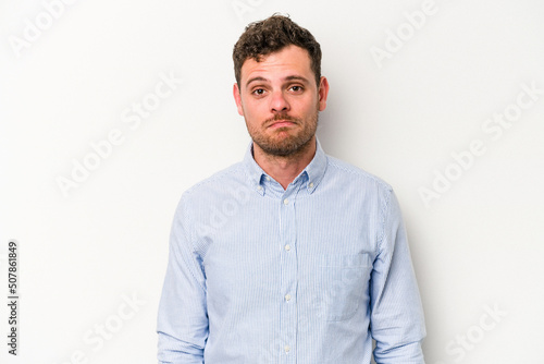 Young caucasian man isolated on white background sad, serious face, feeling miserable and displeased. © Asier