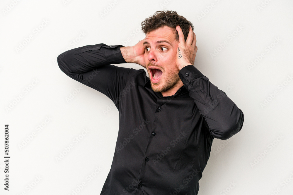 Young caucasian man isolated on white background screaming, very excited, passionate, satisfied with something. Young caucasian man isolated on white background screaming, very excited, passionate, satisfied with something.