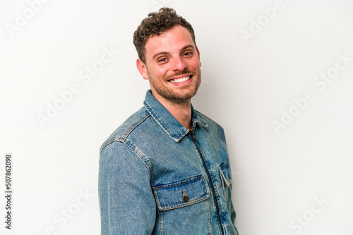 Young caucasian man isolated on white background confident keeping hands on hips.