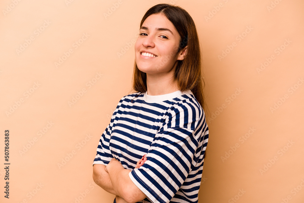 Obraz premium Young hispanic woman isolated on beige background happy, smiling and cheerful.