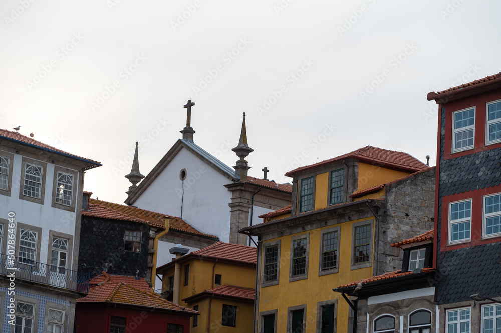 Facades of houses with tiles in the city of Porto in the summer of 2022.
