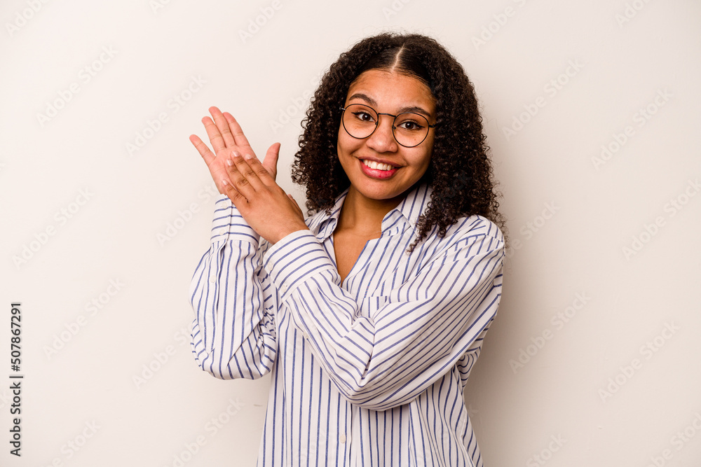 Young African American woman isolated on white background feeling energetic and comfortable, rubbing hands confident. Young African American woman isolated on white background feeling energetic and comfortable, rubbing hands confident.