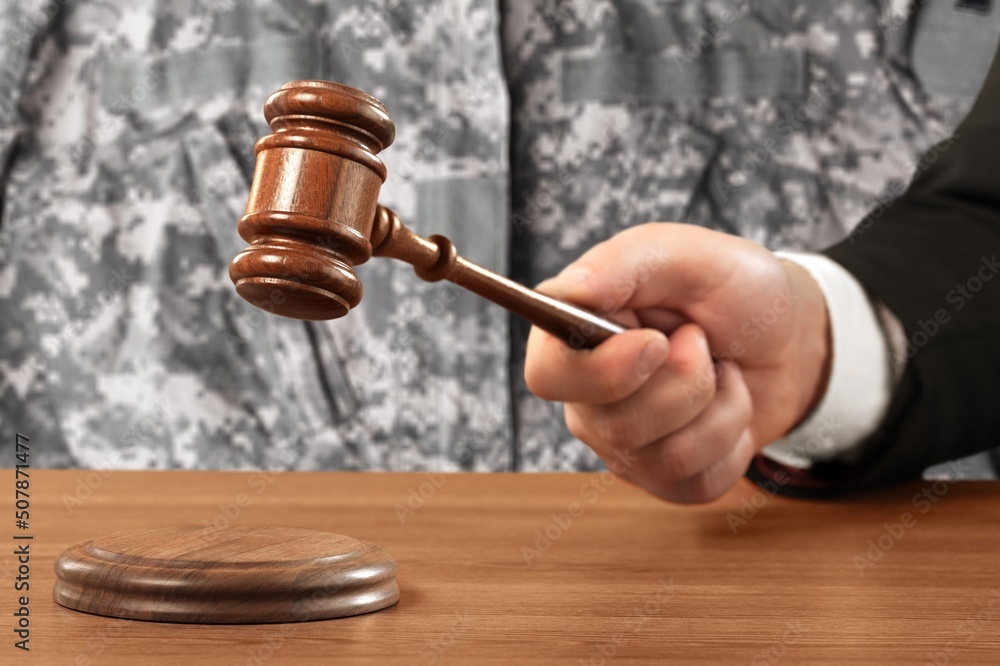Military Law concept, soldier and wooden gavel at courtroom. Military Law concept, soldier and wooden gavel at courtroom.