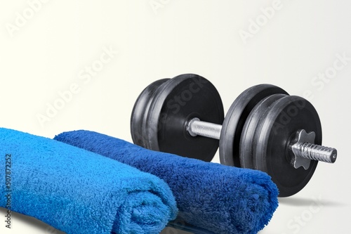 Fototapeta Naklejka Na Ścianę i Meble -  barbell weight and towel at desk. sport gym concept