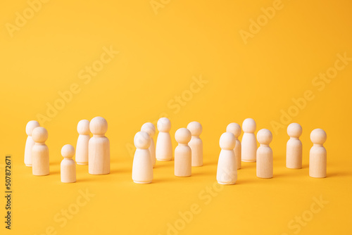 Many figures of people stand at a distance. People Society Concept. Behavior and social science relationships. Manipulation and management. Marketing, segmentation, consumer market research. photo