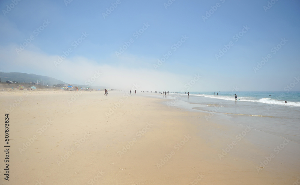 Bolonia beach on the coast of Tarifa with mist and haze, Cadiz, Spain. Bolonia is one of the best beaches on the coast of Cádiz in the Atlantic Ocean