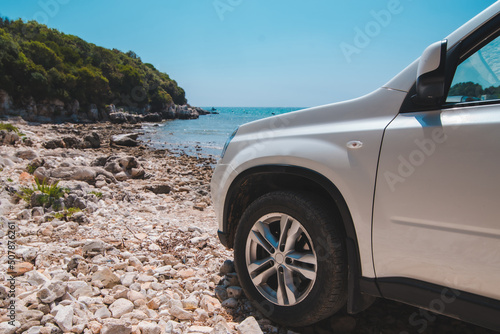 white suv car at summer sea beach photo