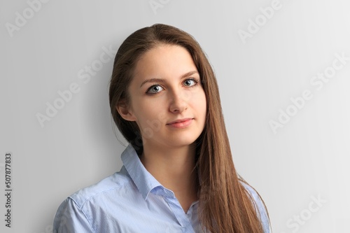 Young smiling happy cheerful employee business corporate lawyer woman posing
