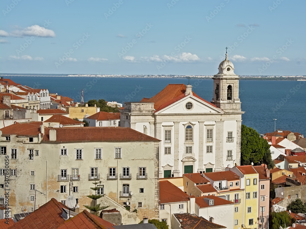 Graca church and traditional houses in front of Tagus river in Lisbon, portugal